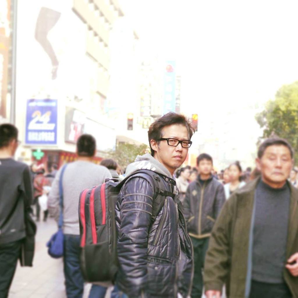 Image may contain: 2 people, people standing and outdoor